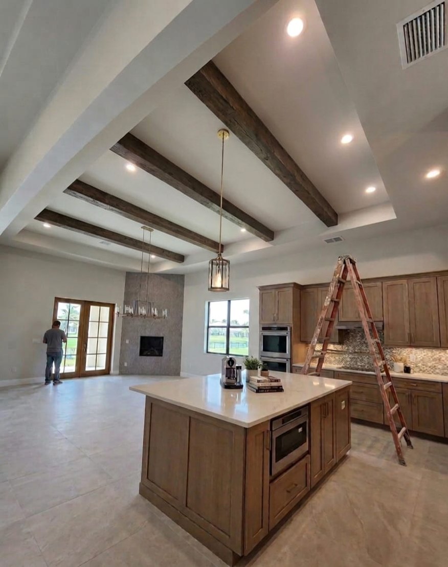 The same Orlando great room after faux wood ceiling beams were installed