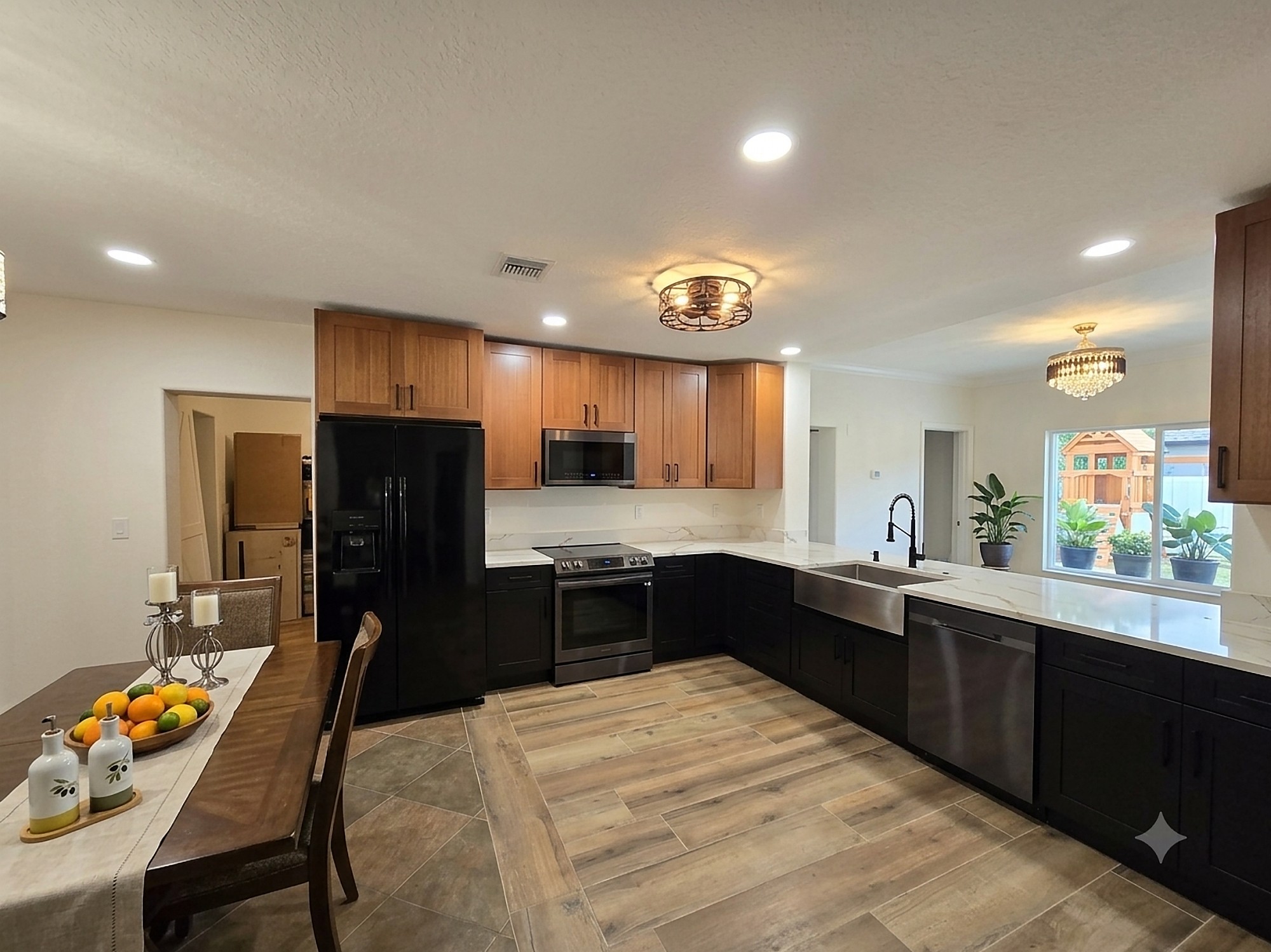 Two-tone wood and black kitchen cabinets